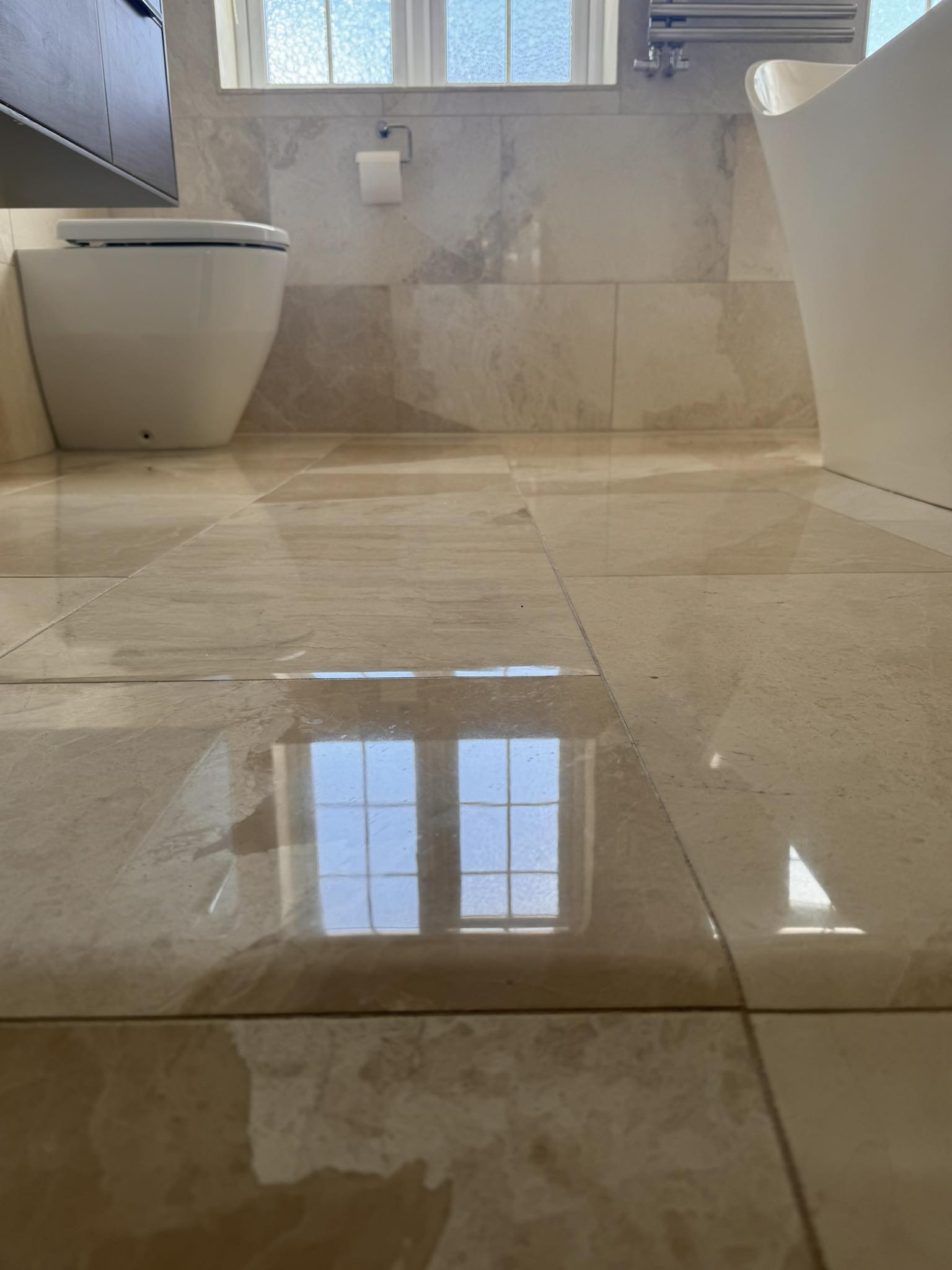 Marble bathroom floor polished and restored by Floorless Restoration