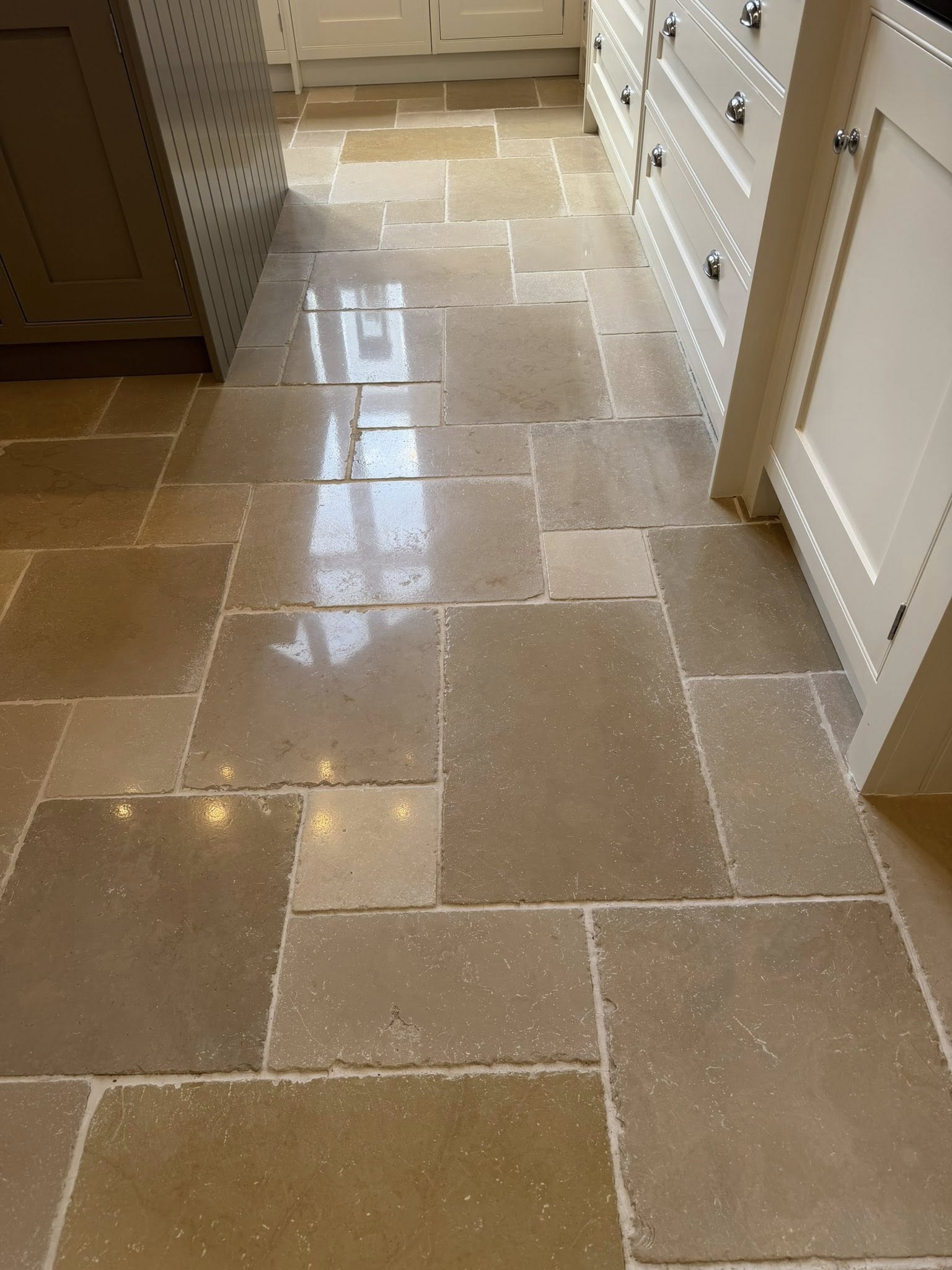 Limestone hallway floor cleaned and polished by Floorless Restoration